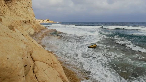 Big waves hit the cliff Stock Footage 123557542