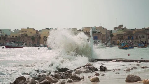 Big waves hitting a statue on windy day. Stock Footage 108855577