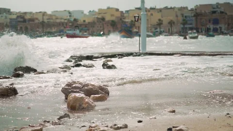 Big waves hitting a statue on windy day. Stock Footage 108855689