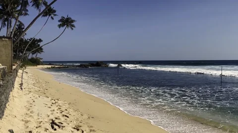 Big waves on the indian ocean beach on the island of sri lanka at sunset Stock Footage 219569012