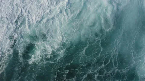 Big waves in the ocean top view. The sea water is foaming. Stock Footage 259626263