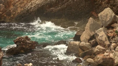Big waves on rocky coast and blue sea Stock Footage 120729253