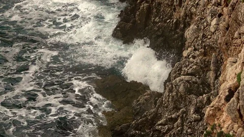Big waves on rocky coast and blue sea Stock Footage 120729477