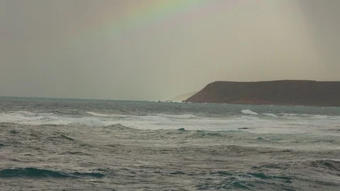 Big waves on rocky coast and blue sea Stock Footage 120730283