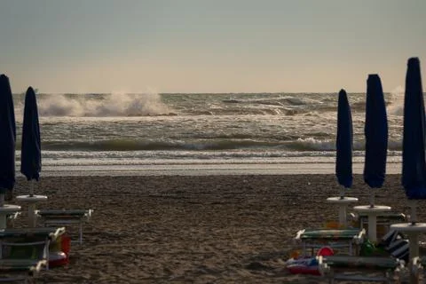 Big waves roll up on the beach Stock Photos