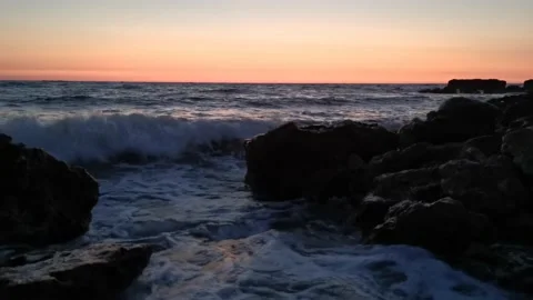 Big waves roll over the rocks. Stock Footage 152276997