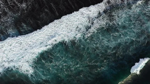 Big Waves rolling from above. Top down 4k drone view on blue turquoise ocean Stock Footage 121913819