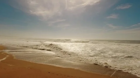 Big waves on sandy beach Stock Footage 72288595