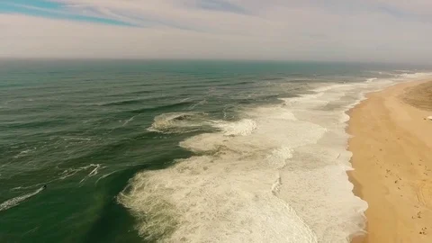 Big waves on sandy beach of the western coast of Portugal aerial Stock Footage 72288390