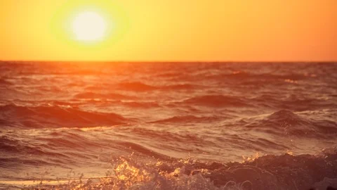Big waves on a sea beach at sunset. Beautiful waves of slow motion video on the Stock Footage 93078441