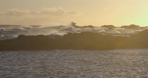 Big waves in the sea at sunset Stock Footage 103807575