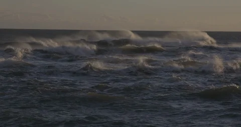 Big waves in the sea at sunset Video stock 103807589