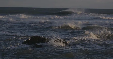 Big waves in the sea at sunset Video stock 103807592
