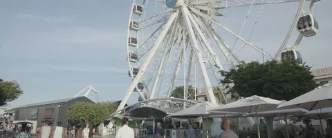 Big wheel turning pan low angle shot - UHD, Apple ProRes 4444 Stock Footage 103802078