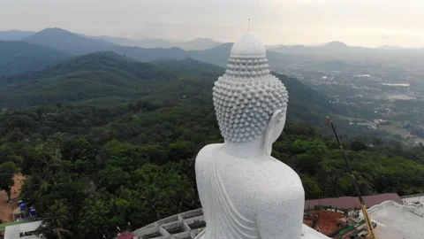 Big white buddha building on mountain aerial view Stock Footage 134915184