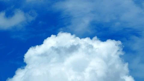 Big white cloud on the blue sky. 库存照片