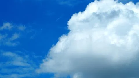 Big white cloud on the blue sky. 库存照片