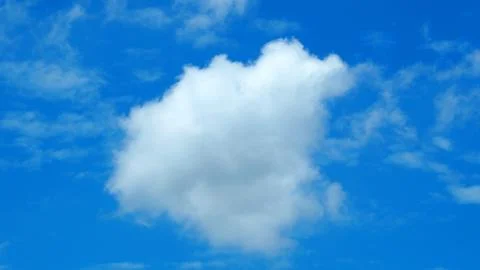 Big white cloud on the blue sky. 库存照片