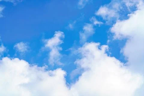 Big white cloud in clear blue sky. Nature Background Stock Photos