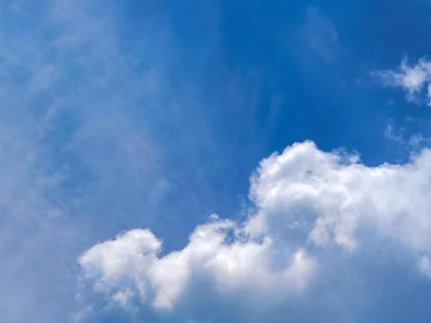 Big white cloud in clear blue sky. Nature Background Stock Photos