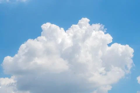Big White Clouds Against bright Blue Sky Stock Photos