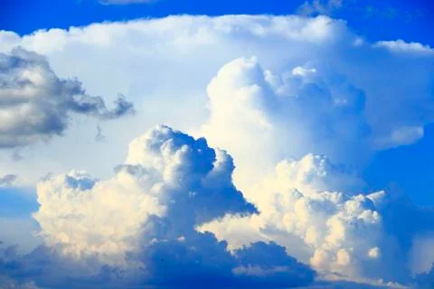 Big white clouds on blue sky. Heaven view Stock Photos
