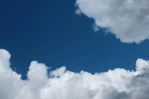 Big white clouds in the blue sky Stock Photos