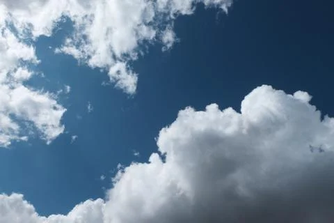 Big white clouds in the blue sky Stock Photos