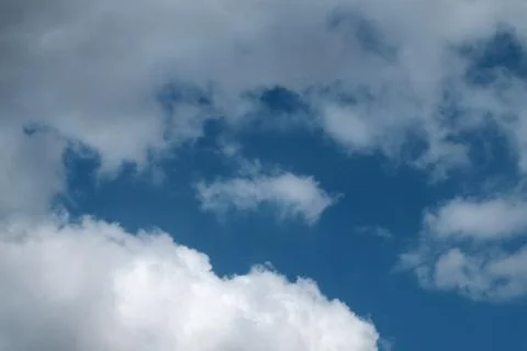 Big white clouds in the blue sky Stock Photos