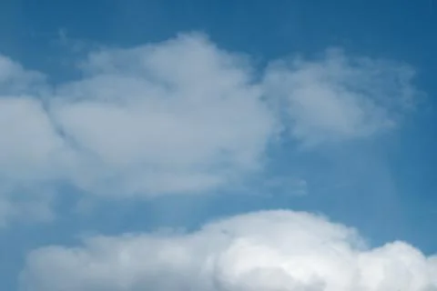 Big white clouds in the blue sky Stock Photos