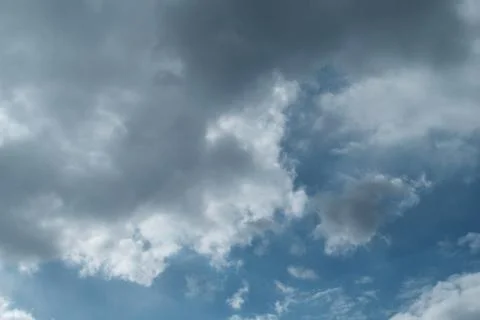 Big white clouds in the blue sky Stock Photos