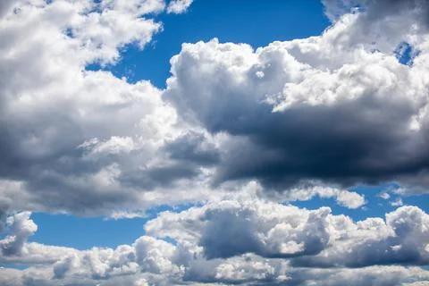 Big white clouds in a blue sky close-up. There is a place for the text Foto stock