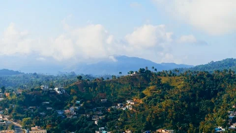 Big white clouds lie on the tops of tropical mountains. Stock Footage 296833067