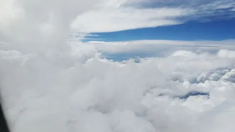Big white clouds, view from the plane porthole Stock Footage 262580498