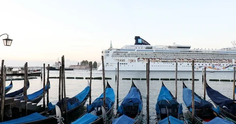 Big white cruise ship passing near gondolas and San Giorgio Maggiore in Venice Stock Footage 128138853