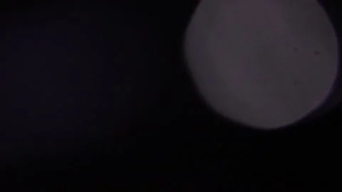 Big white flickering bokeh light from above Видео 309430210