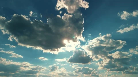 Big white fluffy clouds in the blue sky.Summer background Stockbeeldmateriaal 230444945