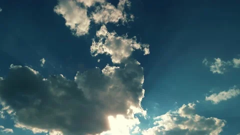 Big white fluffy clouds in the blue sky.Summer background Видео 230445285