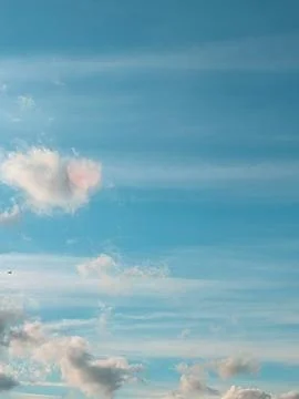 Big White Fluffy Clouds on A Blue Sky With Fine Whispy Lines Stock Photos