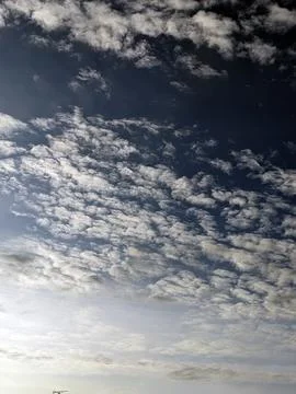 Big White Fluffy Clouds on A Blue Sky With Fine Whispy Lines Stock Photos