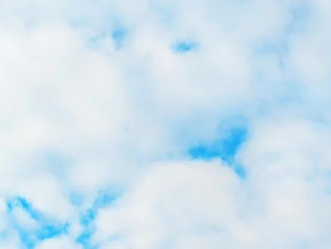 Big White Fluffy Clouds on A Blue Sky With Fine Whispy Lines Stock Photos