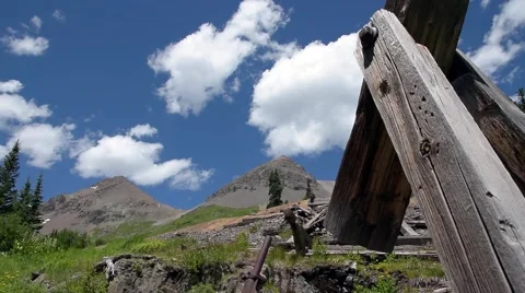 Big white fluffy clouds silently float over the San Juan mountains. Stock Footage 53338905