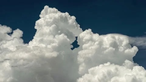 Big white fluffy clouds time lapse. White clouds and blue sky. UHD 4K Video stock 224147749