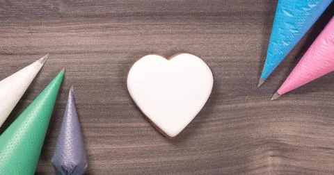 Big white heart shape cookie with icing cones for Mothers day, Womans day or Stock Photos