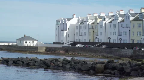 A big white house on the river side in Cushendun Stock Footage 67557898