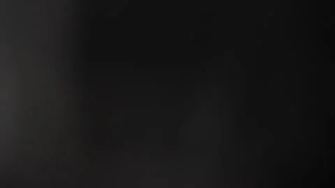 The big white Normat moves back and forth in the blackness. Stock Footage 309571153