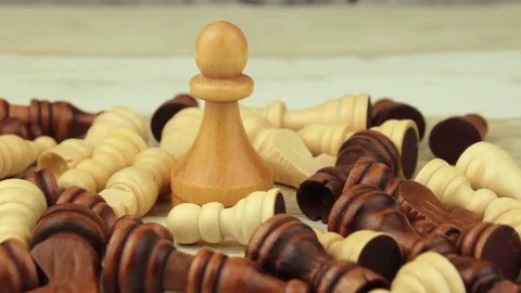 The big white pawn among small chess Stock Footage 78555981