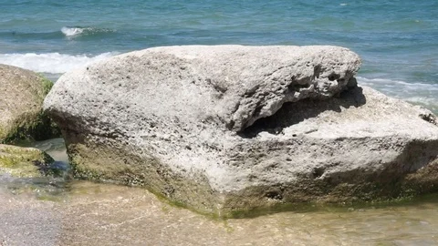 Big white rock in the waterside Stock Footage 112889834