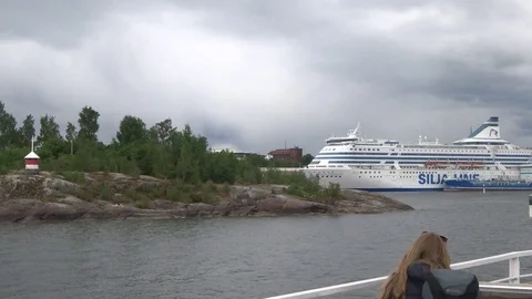 Big white Silja line ferry-ship and small blue cargo ship in harbor of Helsinki Video stock 97651153