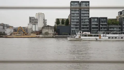 A big white two-deck boat sailing on the River Thames 動画素材 234069105
